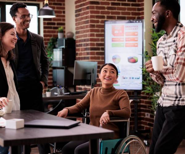 Support worker assisting participants in Innovative Community Participation Sydney program