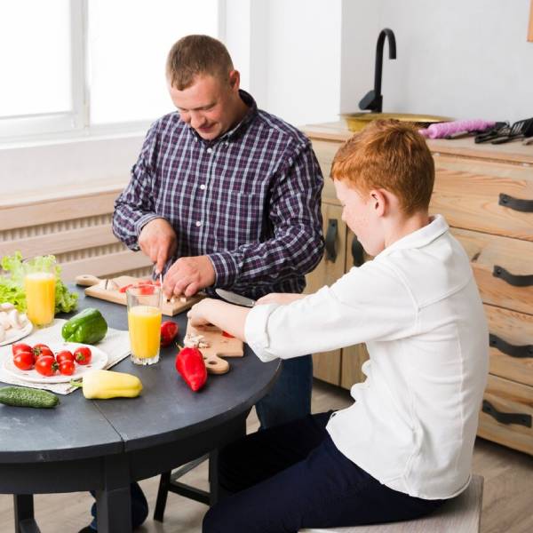 Support worker preparing nutritious meals under NDIS in Sydney home kitchen